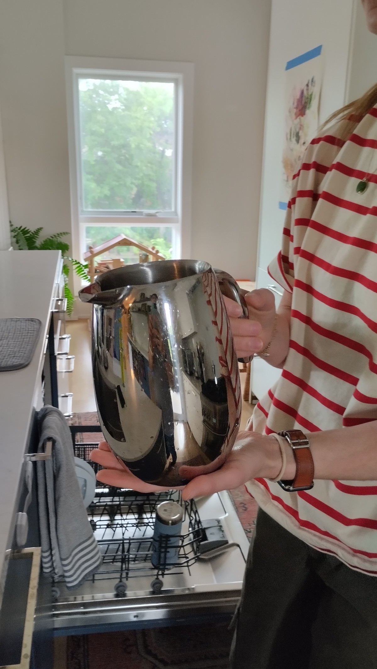 Participant demonstrating a household water container during in-home research